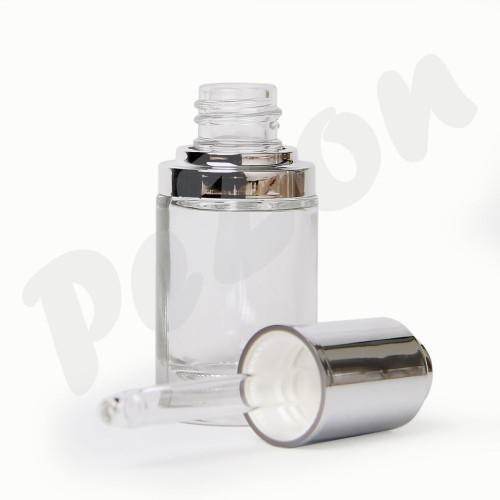 Kulatá transp. skleněná láhev se lesklým stříbrným límcem 15 a 30ml.